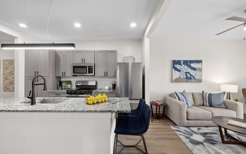 a kitchen with a couch and a sink