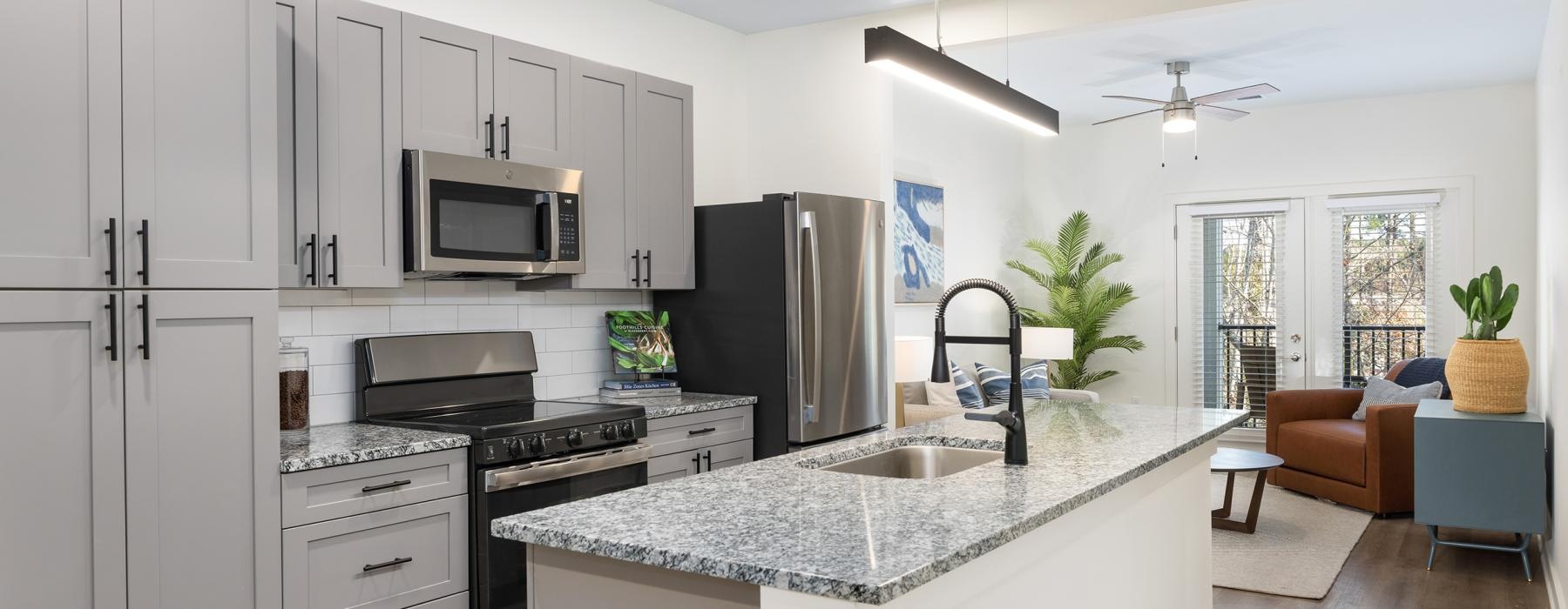 a kitchen with white cabinets