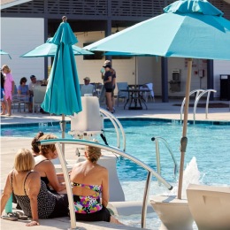 Relax and unwind poolside People relaxing poolside