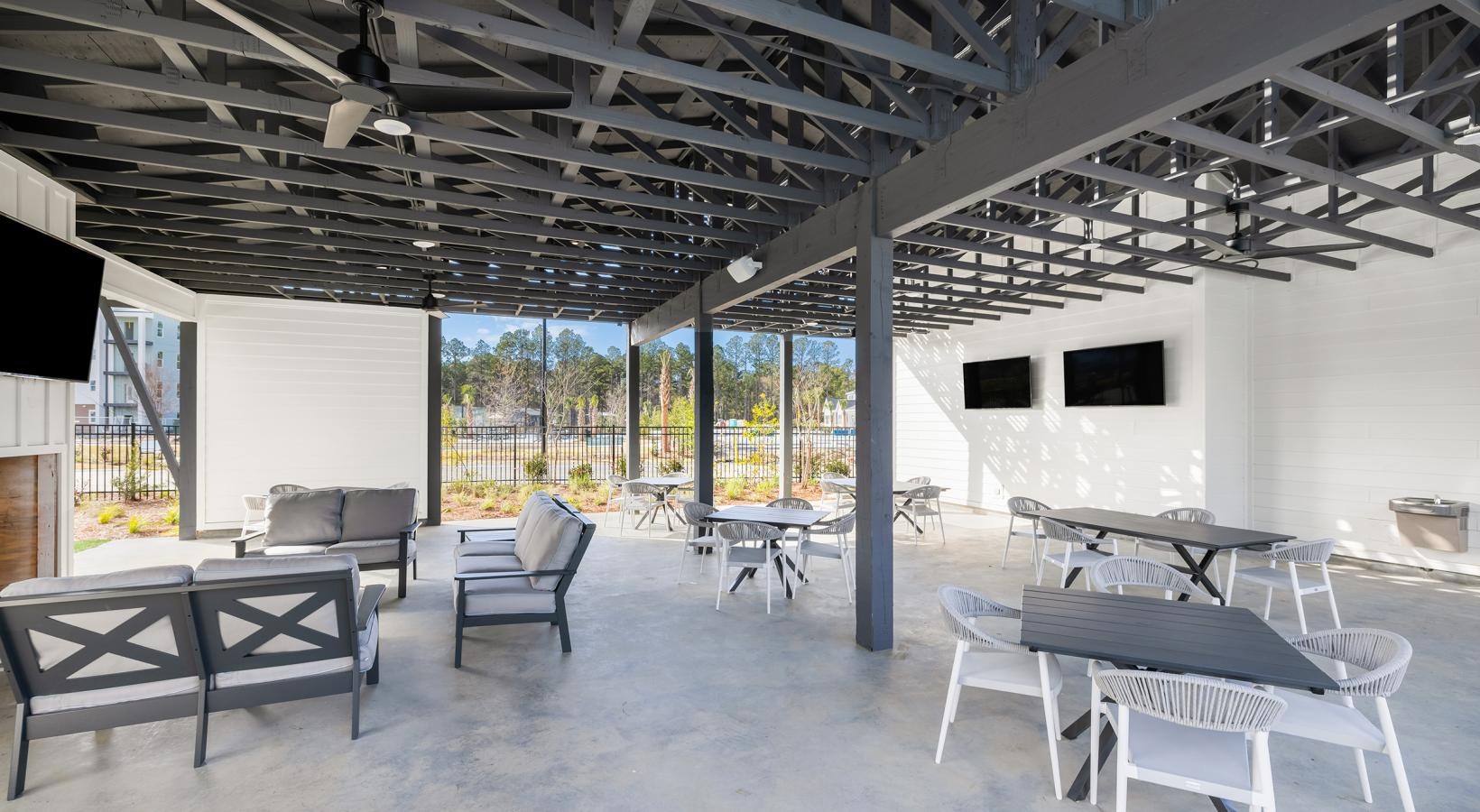 Enjoy our resident-only features a room with tables and chairs