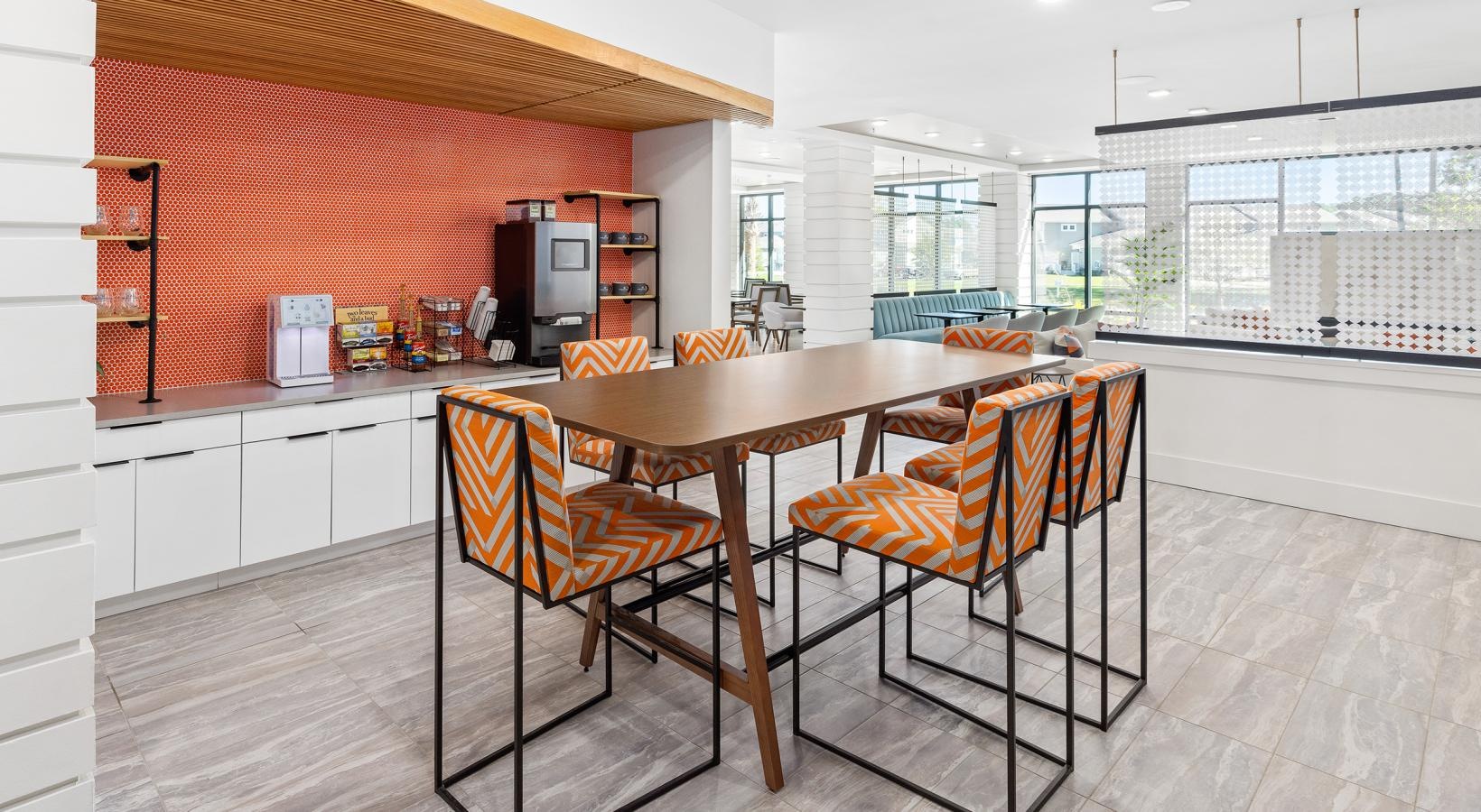 Find your perfect fit at Restore at Carolina Park a kitchen with a table and chairs