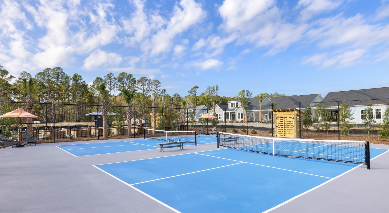 Quick access to state-of-the-art amenities a tennis court with a net