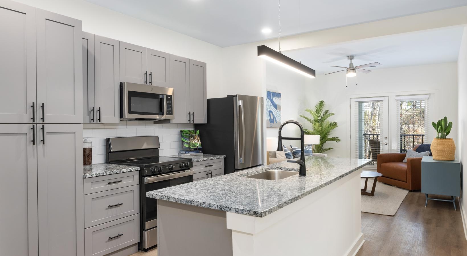 Beautiful living areas to match your lifestyle a kitchen with white cabinets