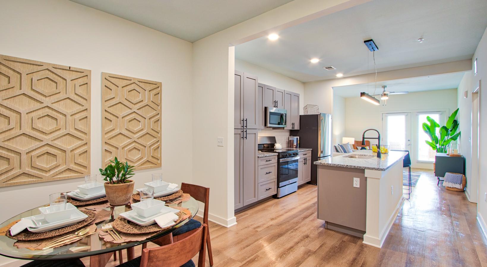 Spacious kitchens with thoughtful details a kitchen with a dining table