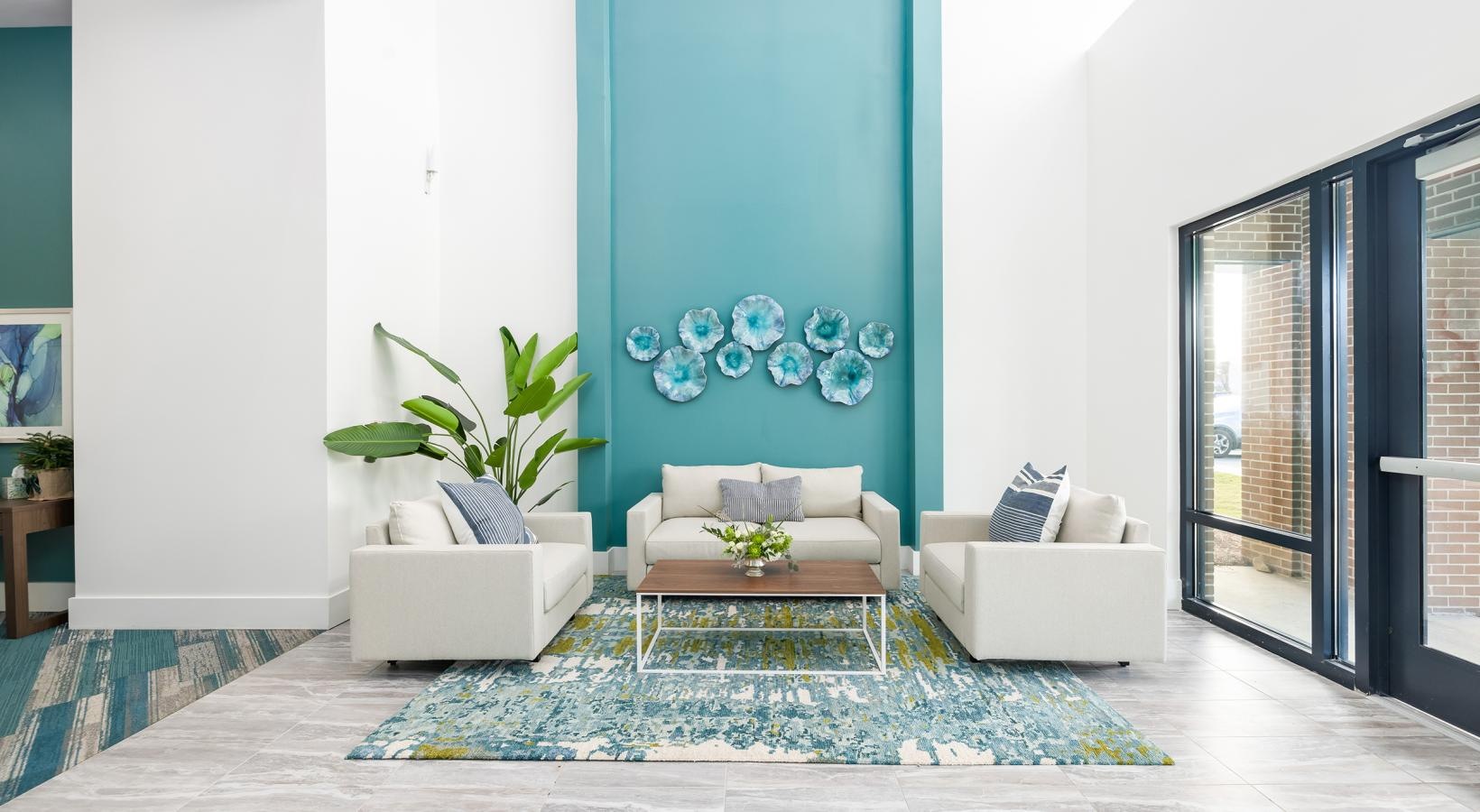 Take advantage of all Restore at Carolina Park has to offer a living room with a blue wall