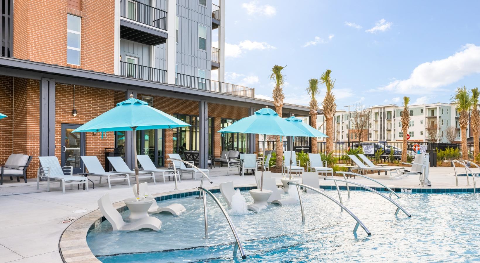 Sparkling swimming pool a pool with chairs and umbrellas by a building